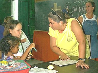 Cindy helps a pair o' kids